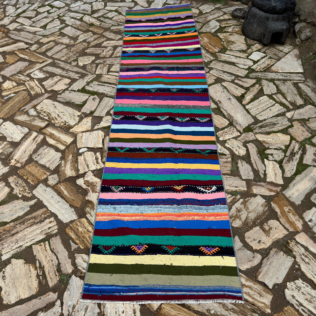 Pink 3' x 10' Turkish striped kilim runner rug in wool and cotton, shown on the floor.