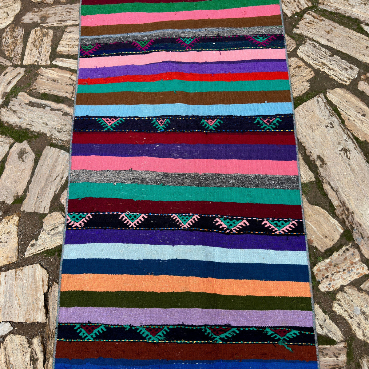 1970s pink Turkish striped kilim runner rug with striped design, flatweave construction and low pile.