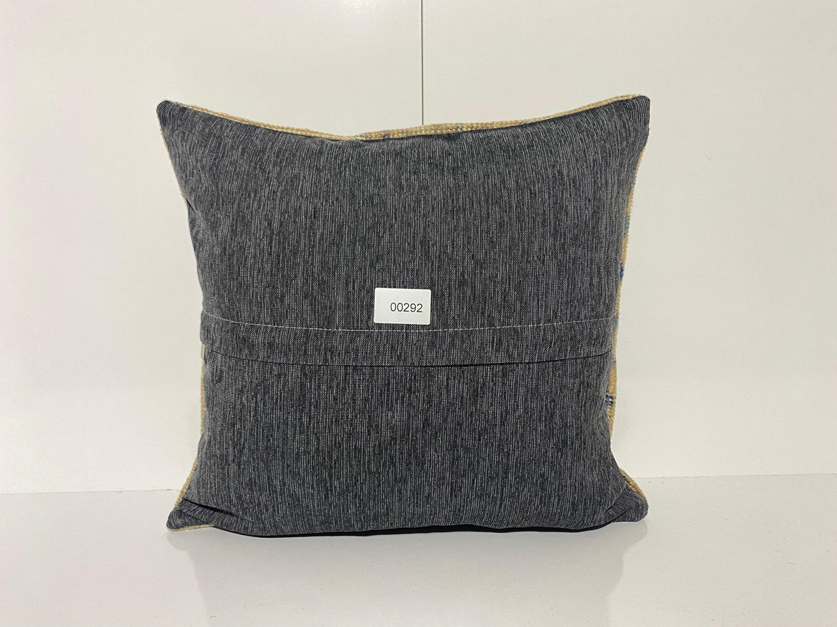 Close-up of the beige Turkish throw pillow showing neutral details, low pile.