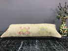 Close-up of the beige Turkish throw pillow showing traditional details, low pile.