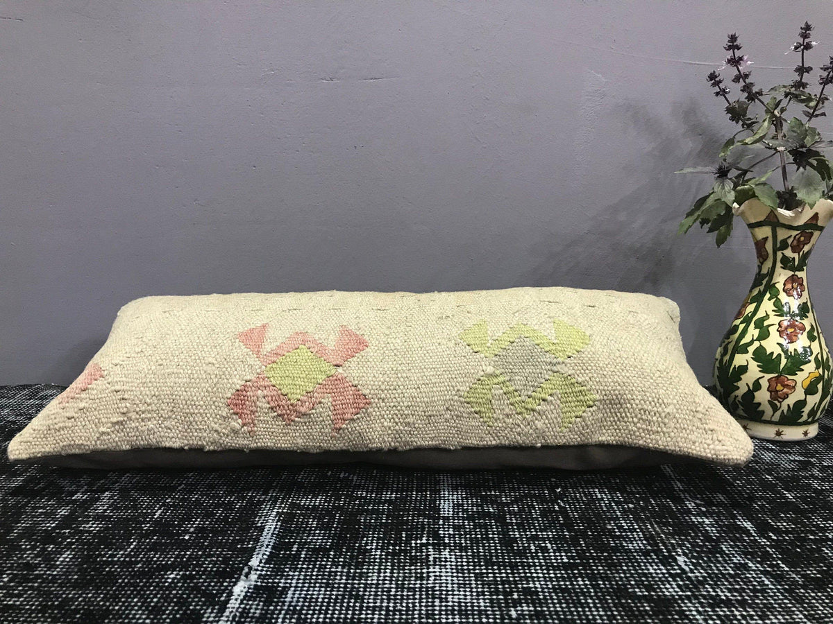 Close-up of the beige Turkish throw pillow showing traditional details, low pile.