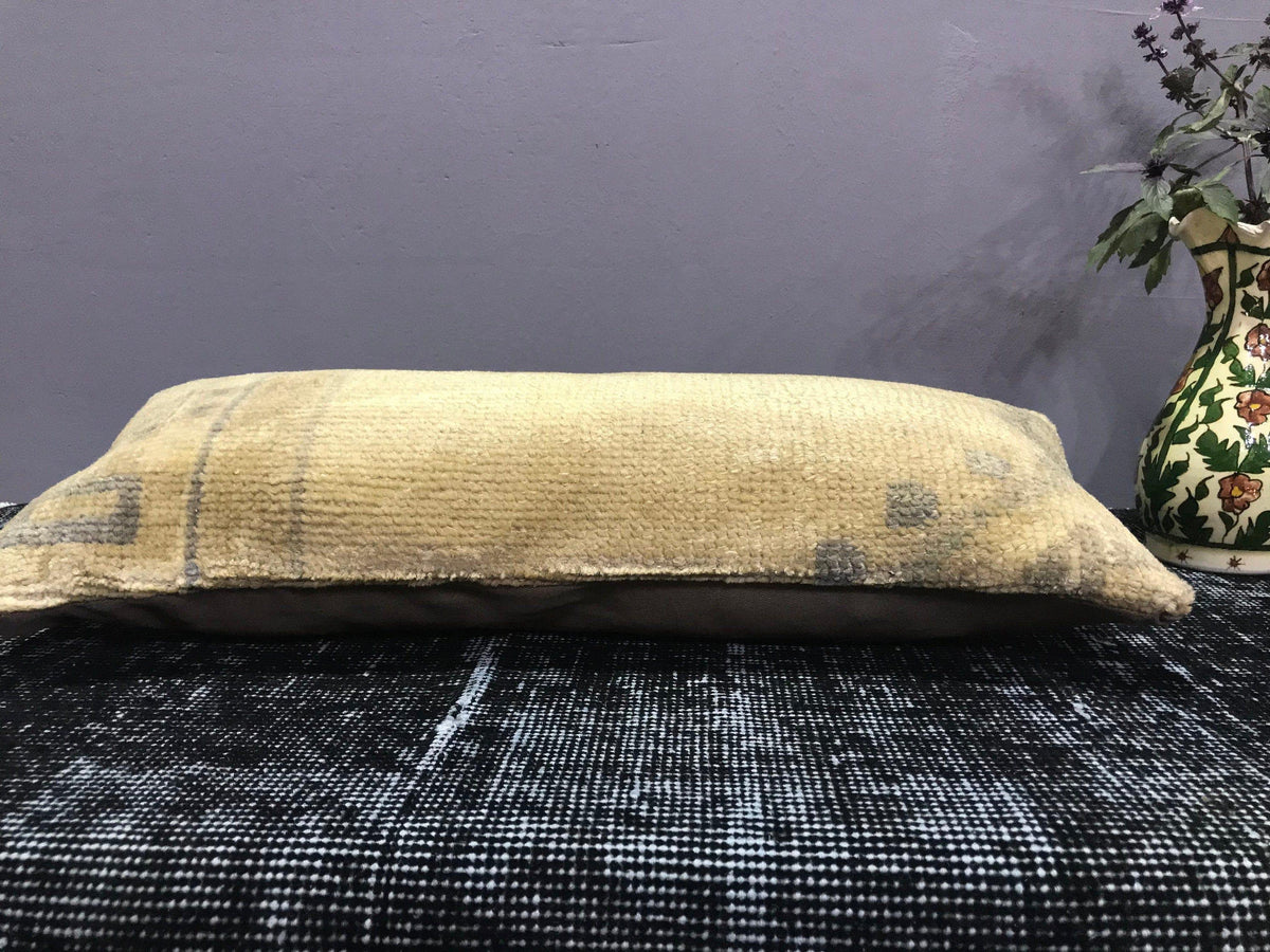 Close-up of the beige Turkish throw pillow showing traditional details, low pile.