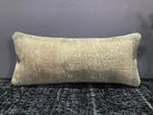 Close-up of the beige Turkish throw pillow showing neutral details, low pile.