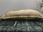 Beige Turkish throw pillow, shown on the floor.