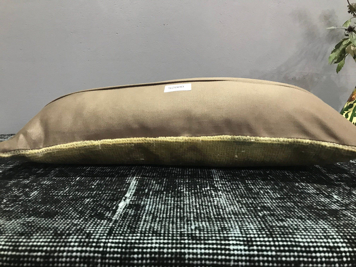 Beige Turkish throw pillow, shown on the floor.