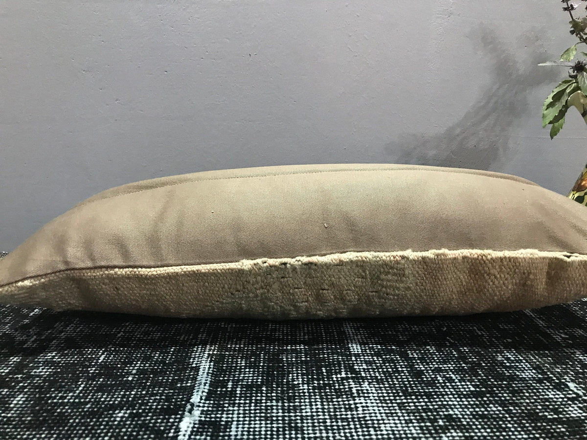 Close-up of the beige Turkish throw pillow showing traditional details, low pile.