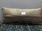 Beige Turkish throw pillow, shown on the floor.