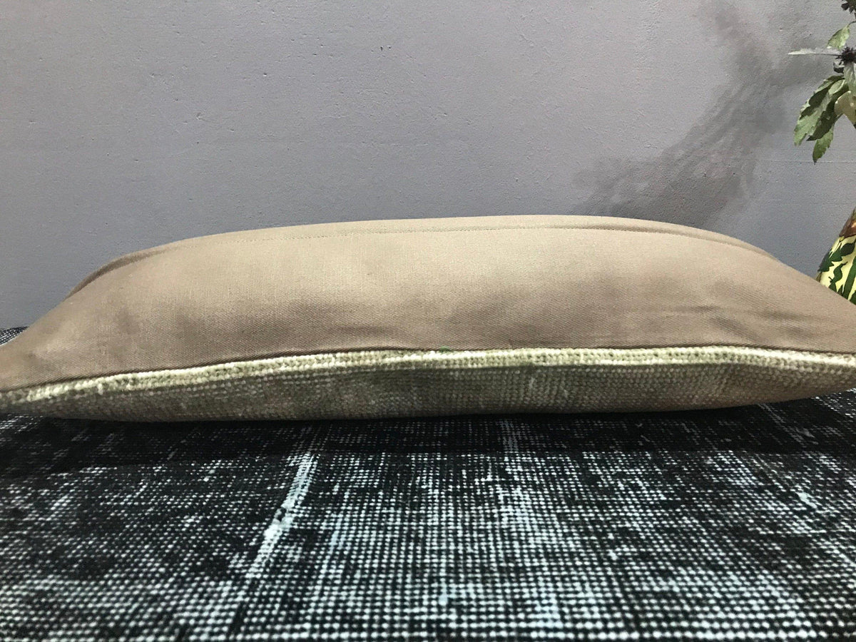 Close-up of the beige Turkish throw pillow showing traditional details, low pile.