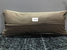 Beige Turkish throw pillow, shown on the floor.