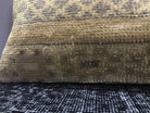Close-up of the beige Turkish throw pillow showing traditional details, low pile.