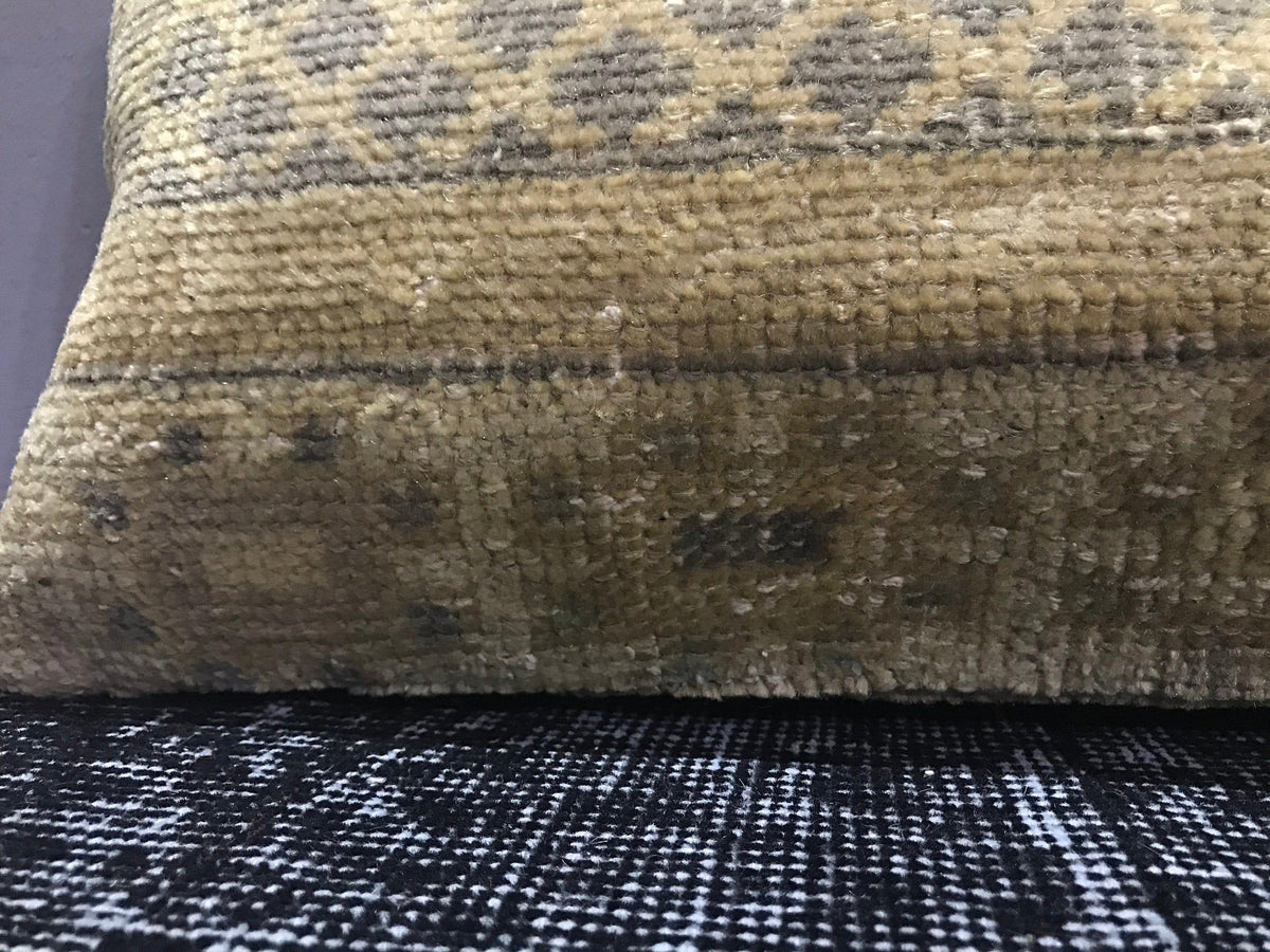 Close-up of the beige Turkish throw pillow showing traditional details, low pile.