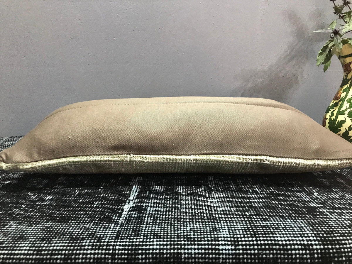 Close-up of the beige Turkish throw pillow showing traditional details, low pile.