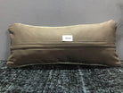 Beige Turkish throw pillow, shown on the floor.