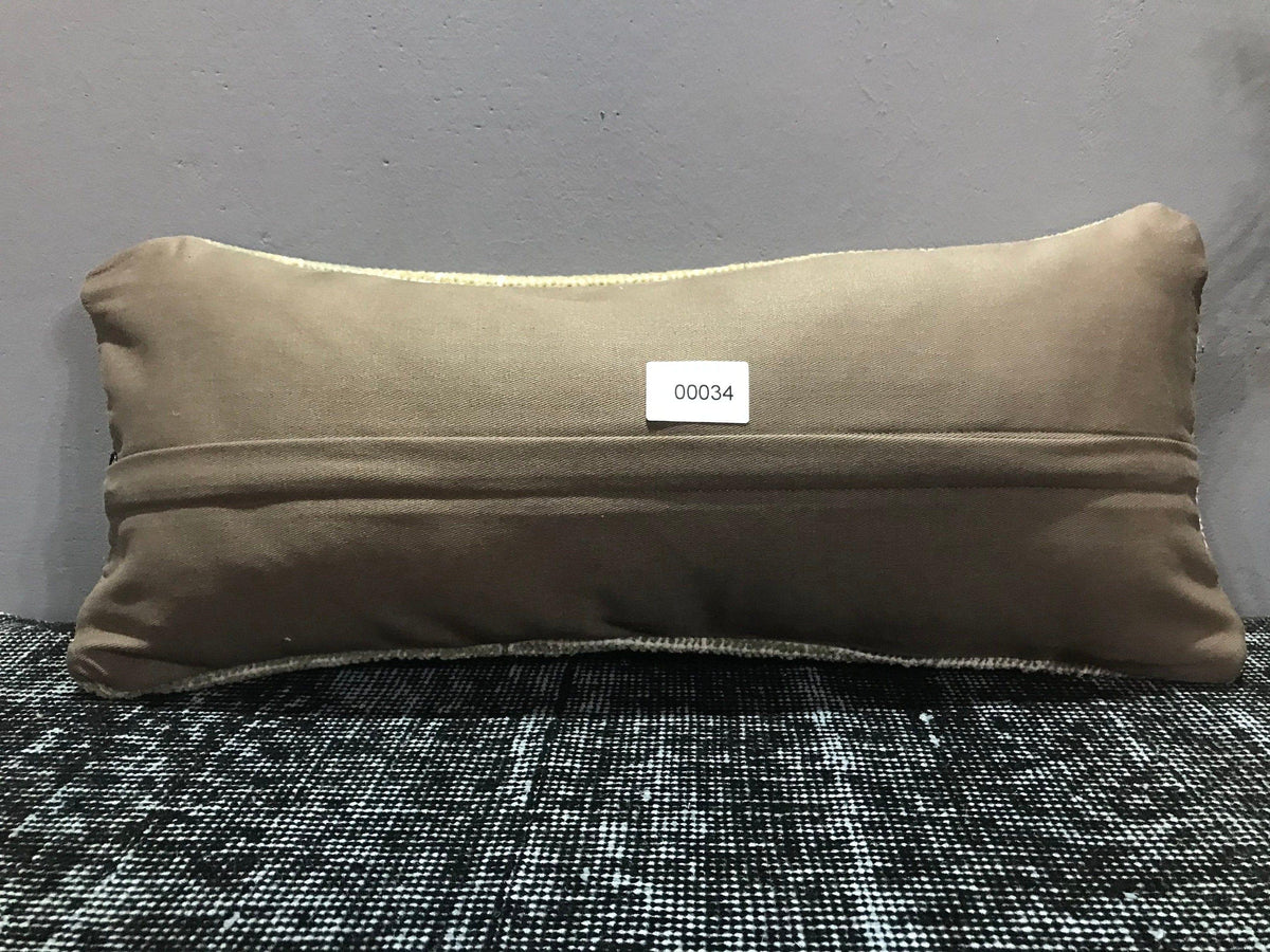 Beige Turkish throw pillow, shown on the floor.