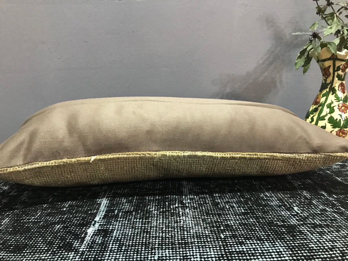 Close-up of the beige Turkish throw pillow showing traditional details, low pile.