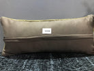 Beige Turkish throw pillow, shown on the floor.