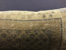 Close-up of the beige Turkish throw pillow showing traditional details, low pile.