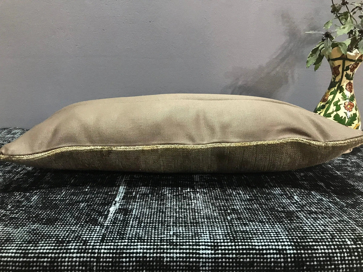 Close-up of the beige Turkish throw pillow showing traditional details, low pile.