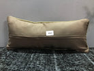 Beige Turkish throw pillow, shown on the floor.