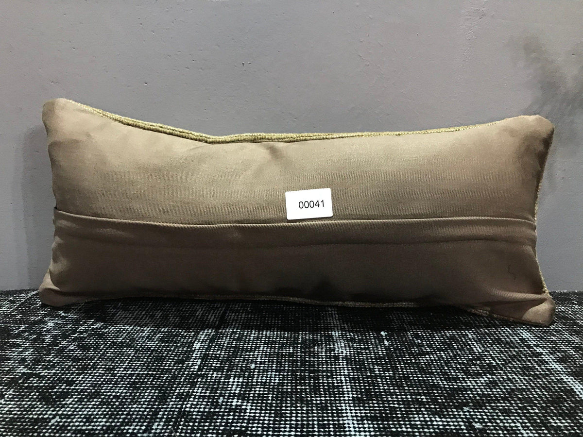 Beige Turkish throw pillow, shown on the floor.