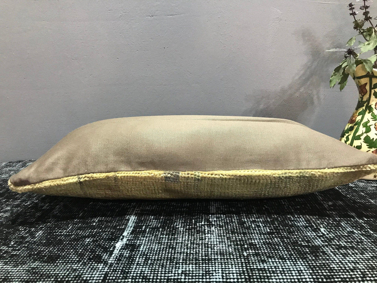 Close-up of the beige Turkish throw pillow showing traditional details, low pile.