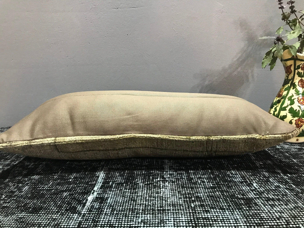 Close-up of the beige Turkish throw pillow showing traditional details, low pile.