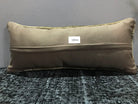 Beige Turkish throw pillow, shown on the floor.