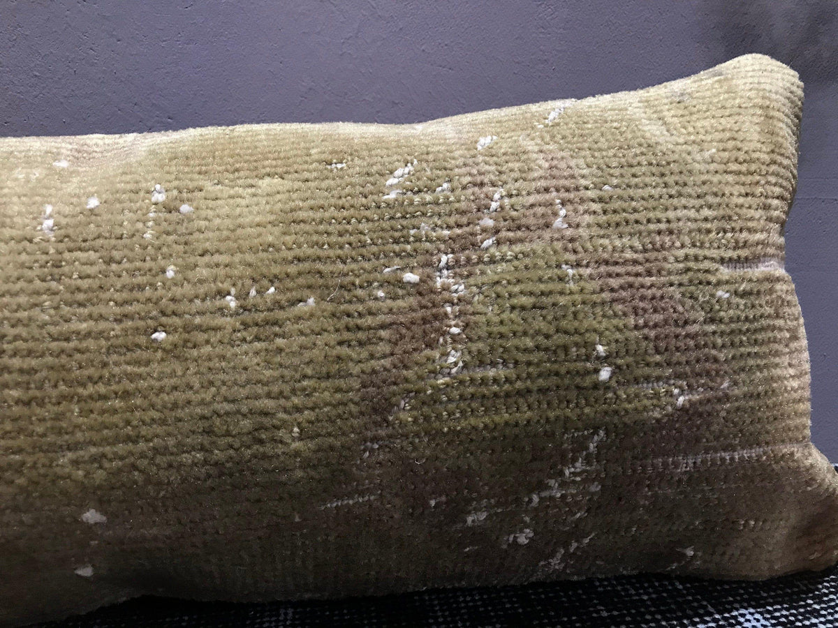 Close-up of the beige Turkish throw pillow showing traditional details, low pile.