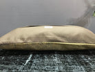 Beige Turkish throw pillow, shown on the floor.