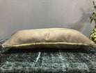 Beige Turkish throw pillow, shown on the floor.