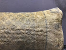 Close-up of the beige Turkish throw pillow showing neutral details, low pile.