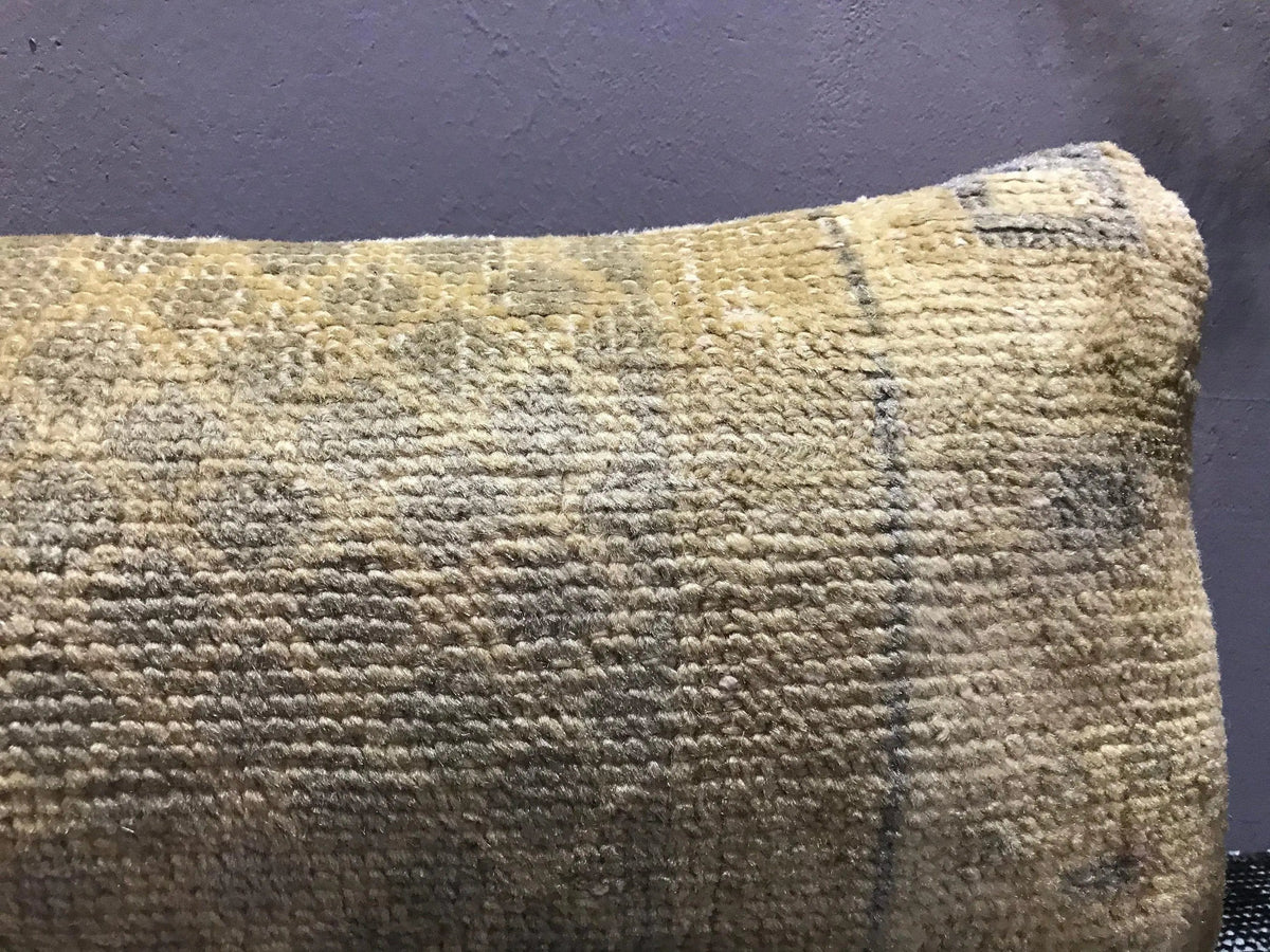 Close-up of the beige Turkish throw pillow showing neutral details, low pile.