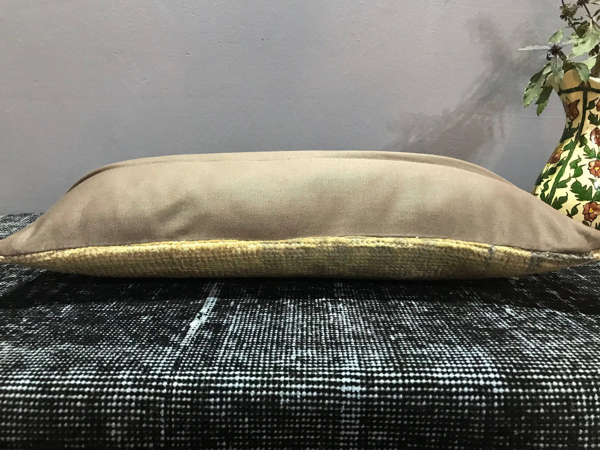 Beige Turkish throw pillow, shown on the floor.