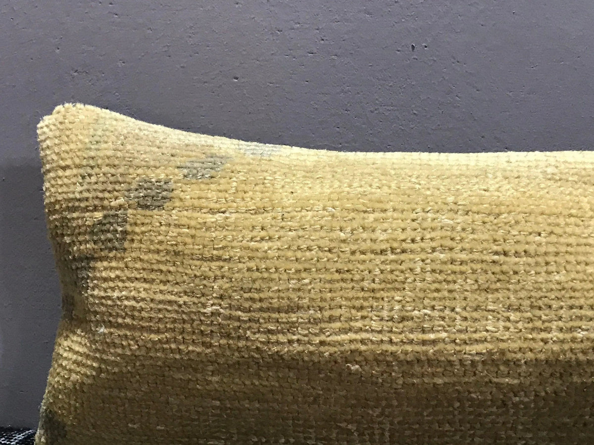 Close-up of the beige Turkish throw pillow showing traditional details, low pile.