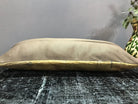 Beige Turkish throw pillow, shown on the floor.