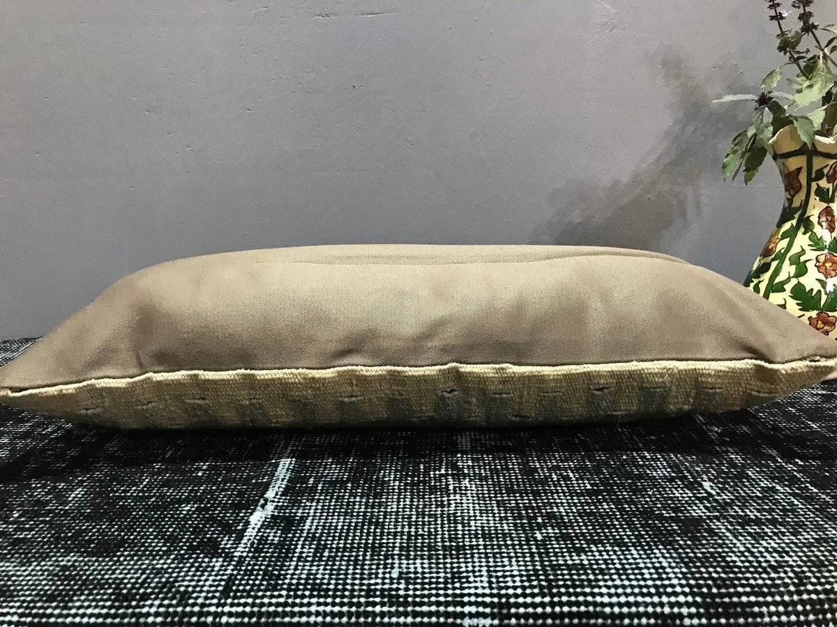 Close-up of the beige Turkish throw pillow showing traditional details, low pile.