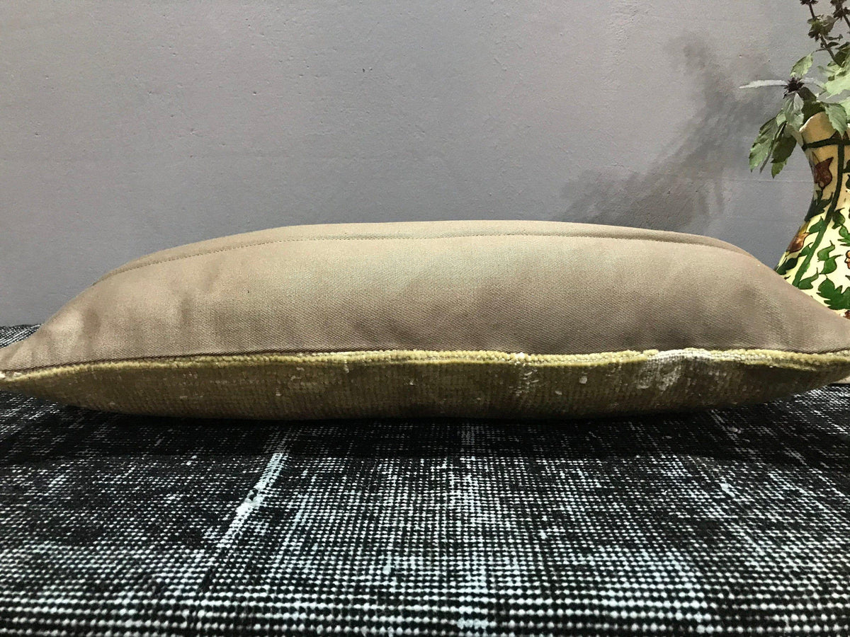 Close-up of the beige Turkish throw pillow showing traditional details, low pile.