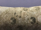 Close-up of the beige Turkish throw pillow showing traditional details, low pile.