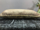 Beige Turkish throw pillow, shown on the floor.