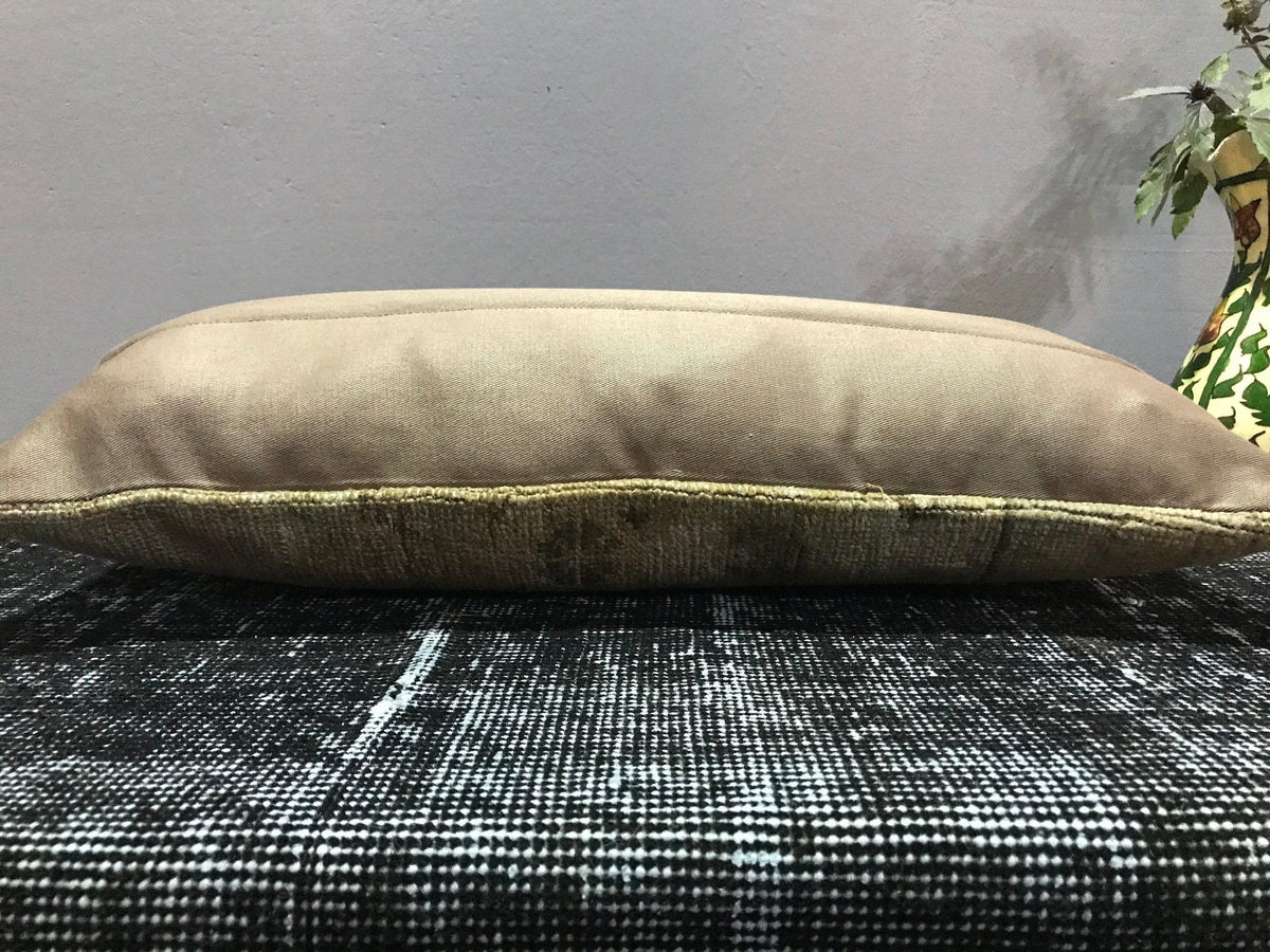 Beige Turkish throw pillow, shown on the floor.