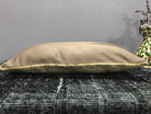 Beige Turkish throw pillow, shown on the floor.