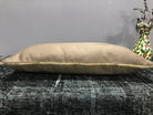 Beige Turkish throw pillow, shown on the floor.