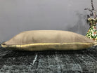 Beige Turkish throw pillow, shown on the floor.