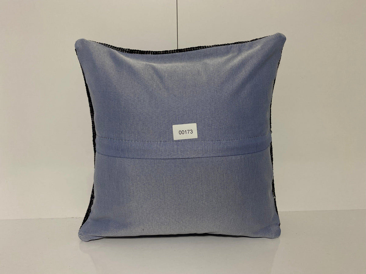 Close-up of the black Turkish throw pillow showing overdyed details, low pile.
