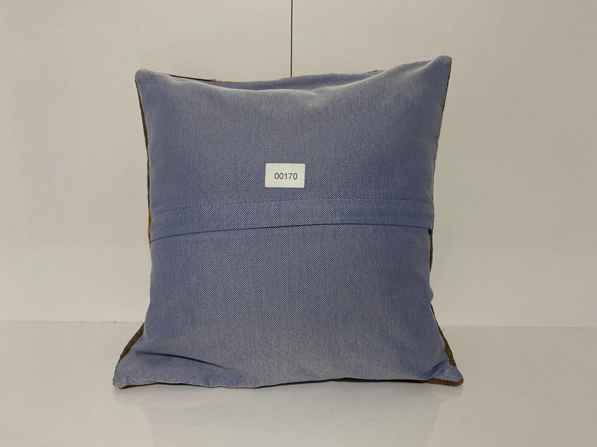 Close-up of the brown Turkish throw pillow showing traditional details, low pile.