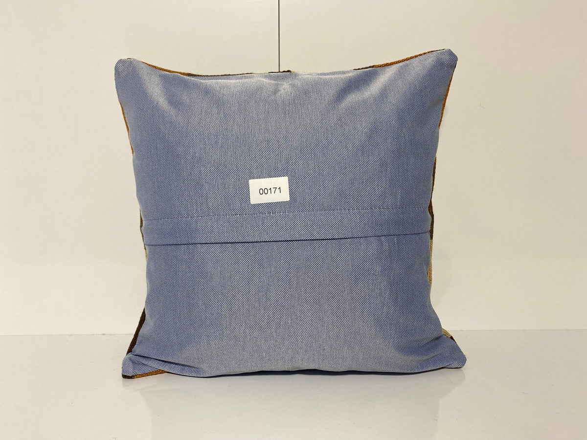 Close-up of the brown Turkish throw pillow showing traditional details, low pile.