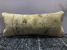 Close-up of the brown Turkish throw pillow showing traditional details, low pile.