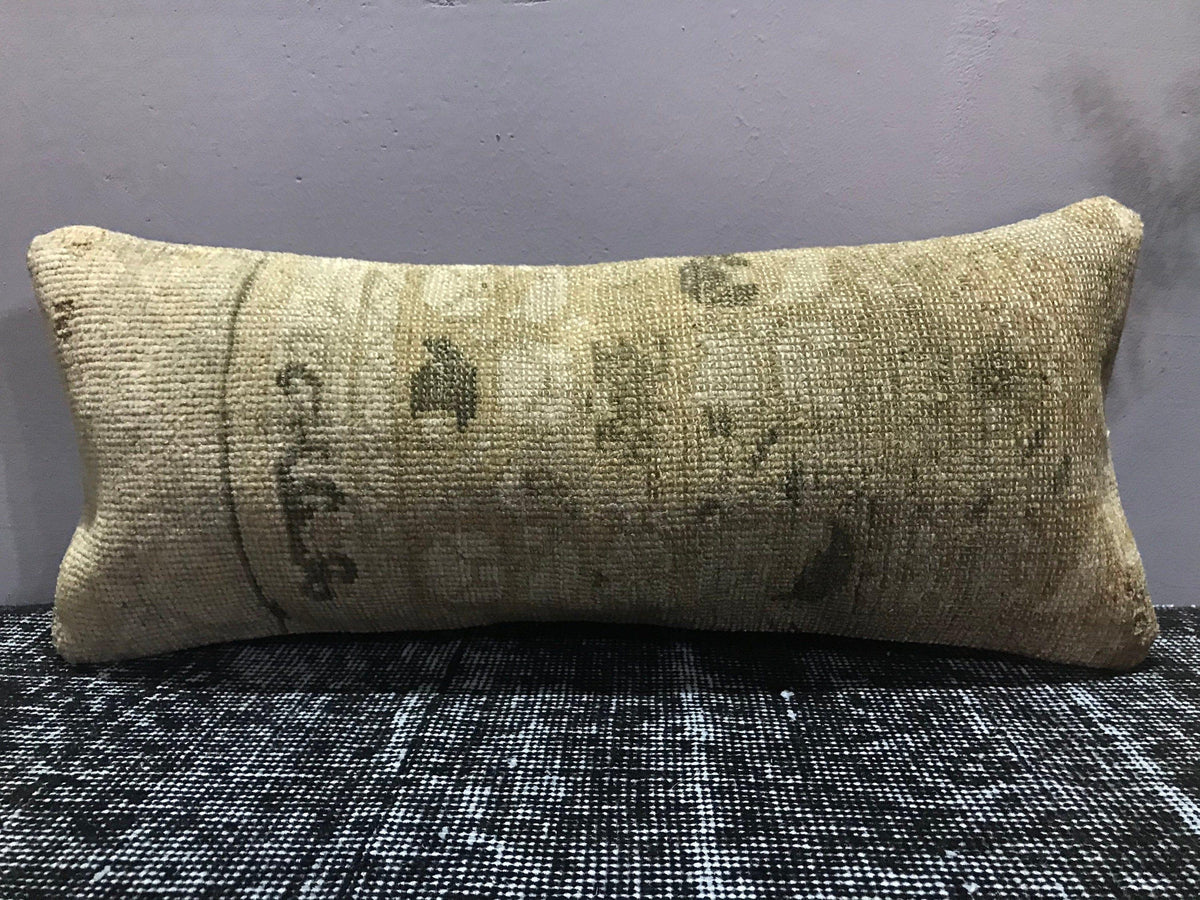 Close-up of the brown Turkish throw pillow showing traditional details, low pile.