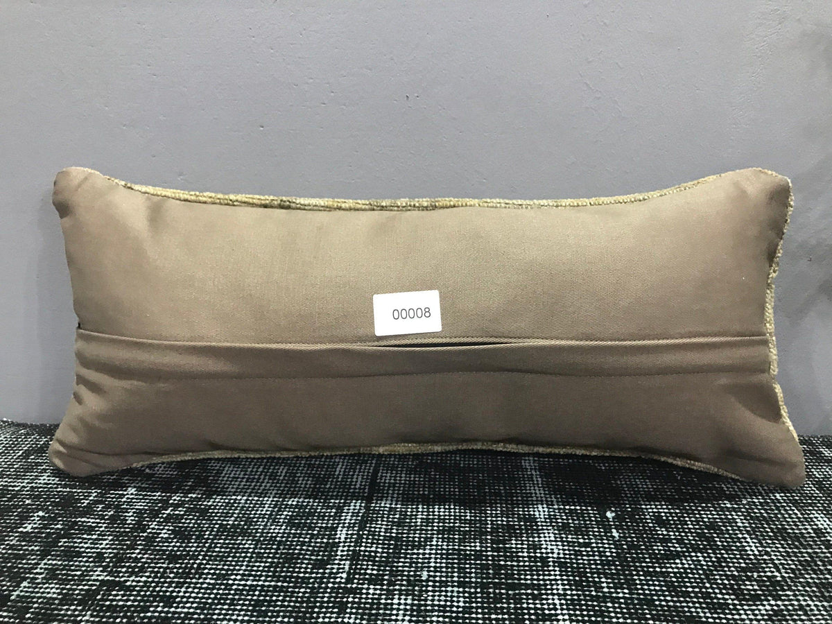 Colorful Turkish throw pillow, shown on the floor.