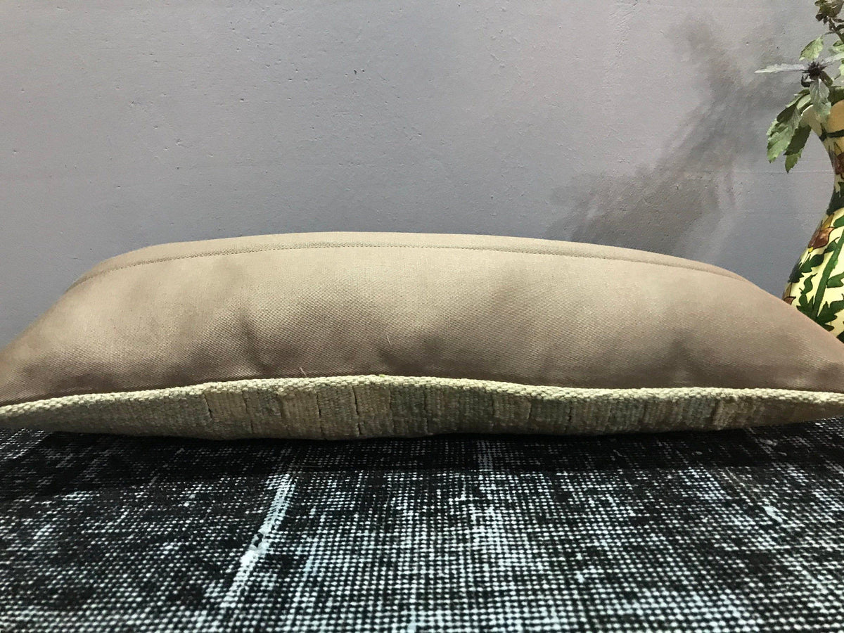 Colorful Turkish throw pillow, shown on the floor.